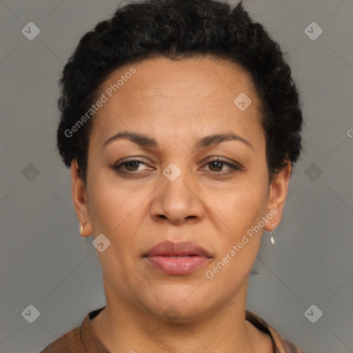 Joyful black adult female with short  brown hair and brown eyes