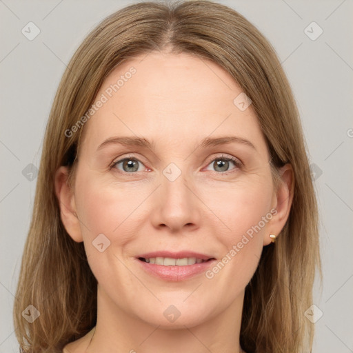 Joyful white adult female with medium  brown hair and grey eyes