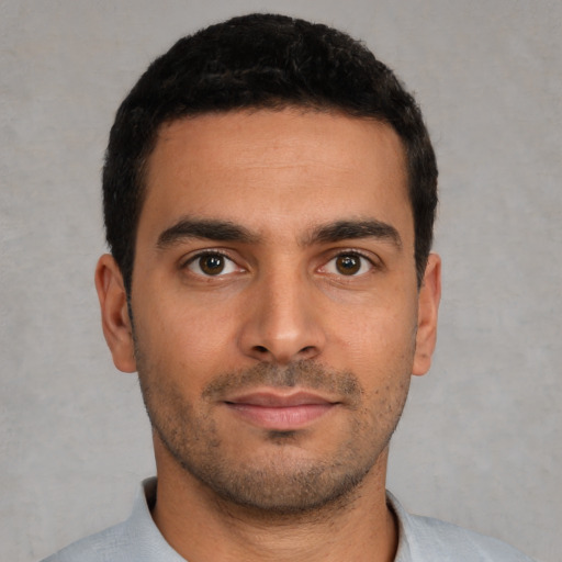 Neutral latino young-adult male with short  brown hair and brown eyes