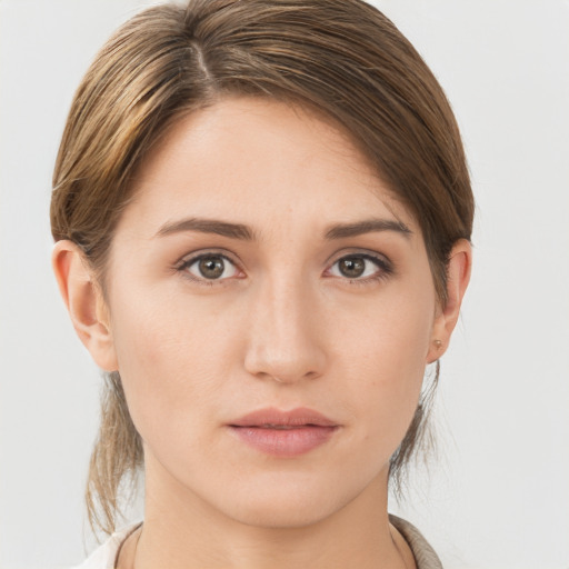 Neutral white young-adult female with medium  brown hair and brown eyes