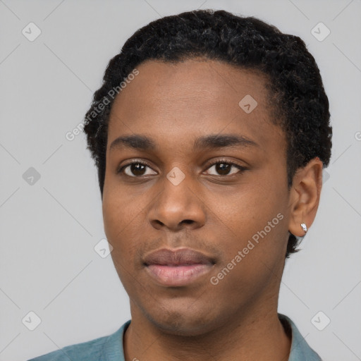 Neutral black young-adult male with short  black hair and brown eyes