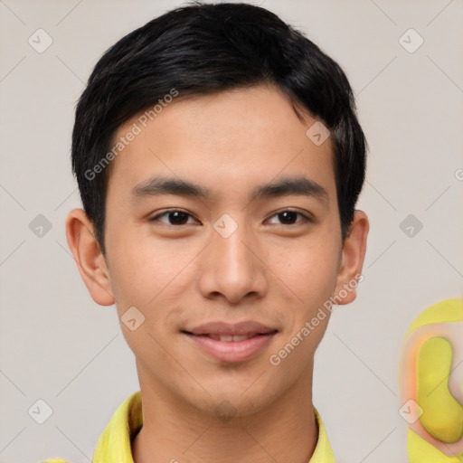 Joyful asian young-adult male with short  brown hair and brown eyes