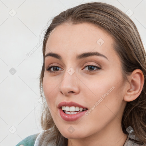 Joyful white young-adult female with long  brown hair and blue eyes