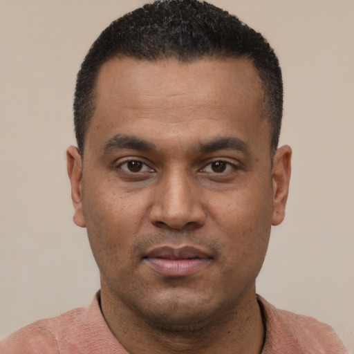 Neutral latino young-adult male with short  black hair and brown eyes