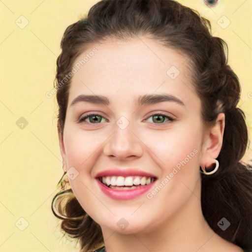 Joyful white young-adult female with long  brown hair and green eyes