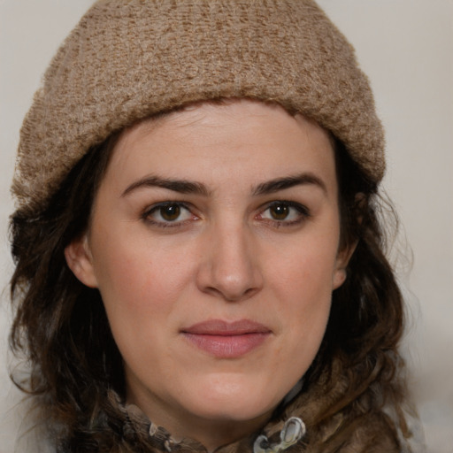 Joyful white young-adult female with medium  brown hair and green eyes