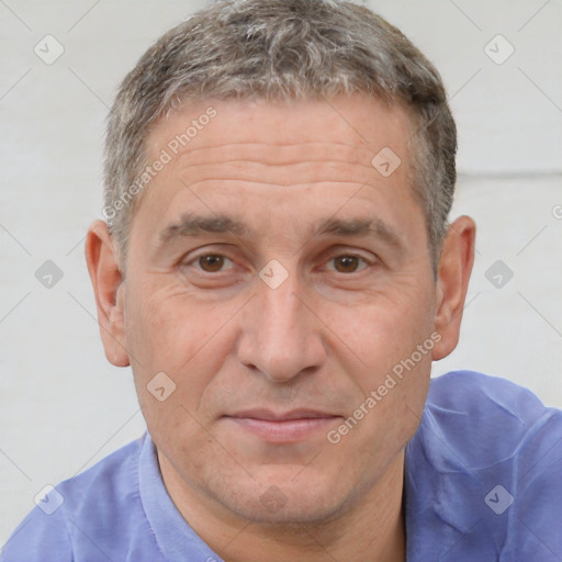 Joyful white middle-aged male with short  brown hair and brown eyes