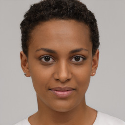 Joyful black young-adult female with short  brown hair and brown eyes