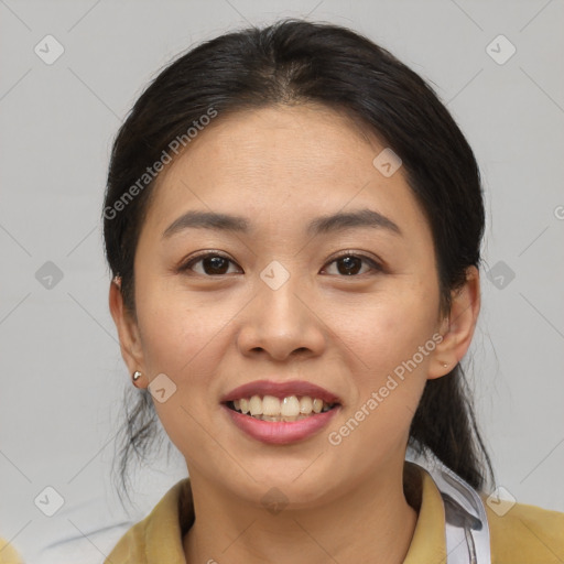 Joyful asian young-adult female with medium  brown hair and brown eyes