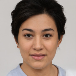 Joyful asian young-adult female with short  brown hair and brown eyes