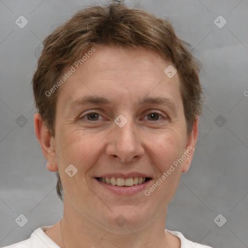 Joyful white adult female with short  brown hair and grey eyes