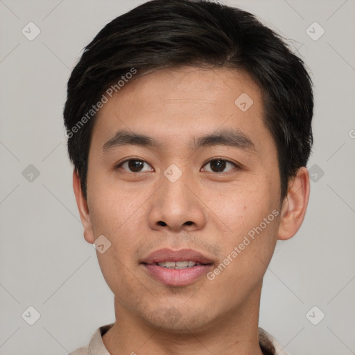 Joyful asian young-adult male with short  brown hair and brown eyes