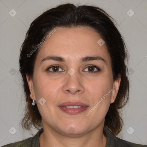 Joyful white adult female with medium  brown hair and brown eyes