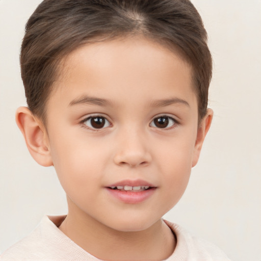 Joyful white child female with short  brown hair and brown eyes