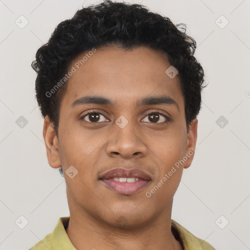 Joyful latino young-adult male with short  brown hair and brown eyes