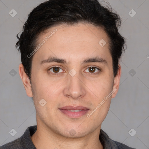 Joyful white adult male with short  brown hair and brown eyes