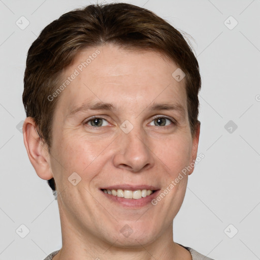 Joyful white adult male with short  brown hair and grey eyes