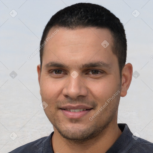 Joyful white young-adult male with short  black hair and brown eyes