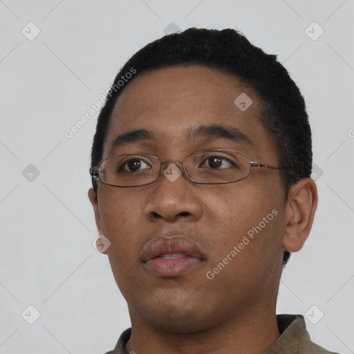 Neutral black young-adult male with short  black hair and brown eyes