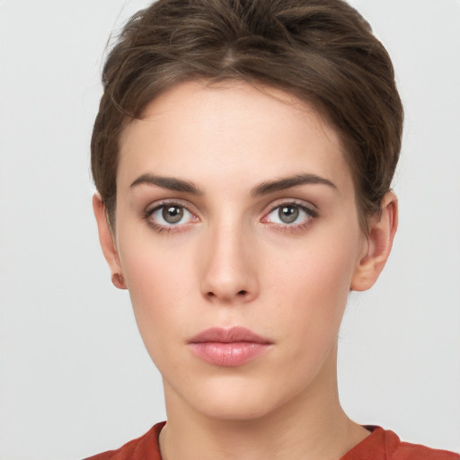 Neutral white young-adult female with short  brown hair and grey eyes