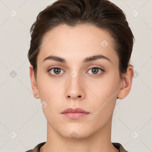 Neutral white young-adult female with short  brown hair and brown eyes