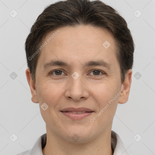 Joyful white adult male with short  brown hair and brown eyes