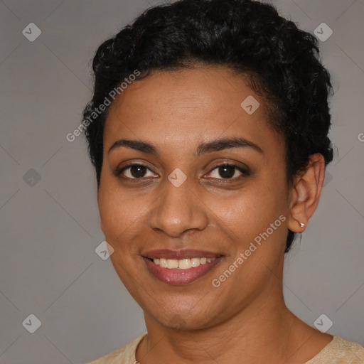 Joyful black young-adult female with short  brown hair and brown eyes