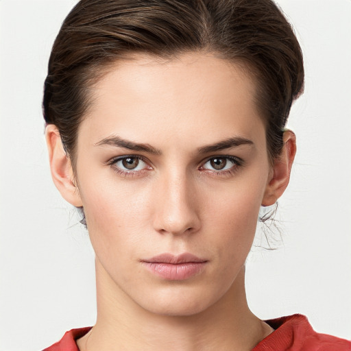 Neutral white young-adult female with medium  brown hair and brown eyes