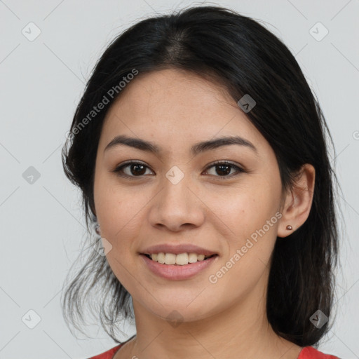 Joyful asian young-adult female with medium  black hair and brown eyes