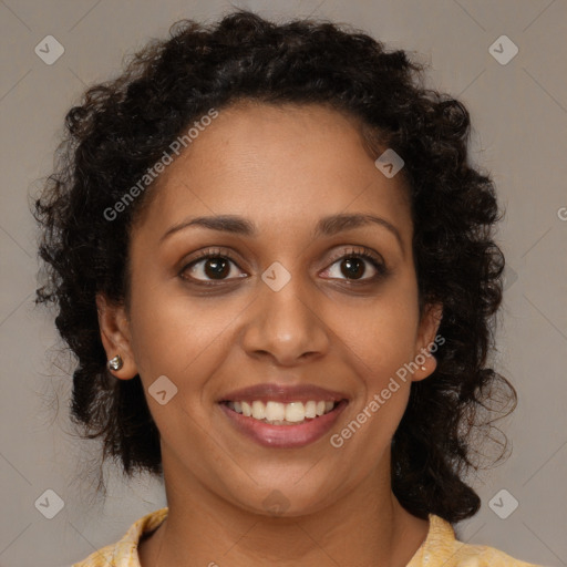 Joyful black young-adult female with medium  brown hair and brown eyes