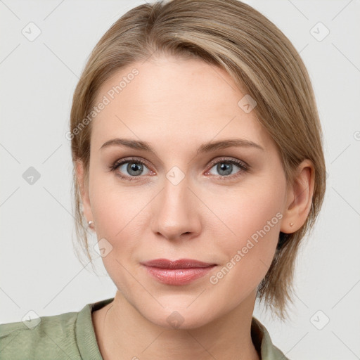 Joyful white young-adult female with medium  brown hair and blue eyes