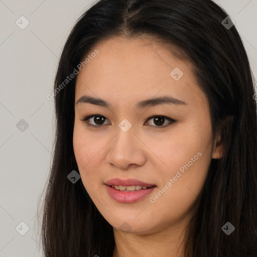 Joyful asian young-adult female with long  brown hair and brown eyes