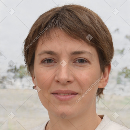 Joyful white adult female with short  brown hair and grey eyes