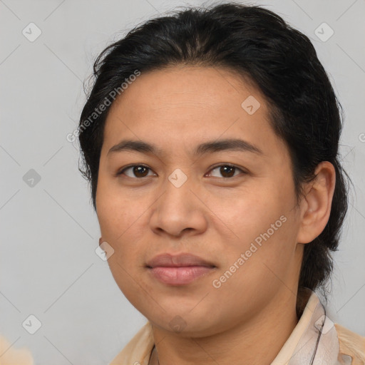 Joyful latino young-adult female with medium  brown hair and brown eyes