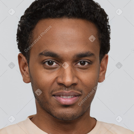 Joyful black young-adult male with short  brown hair and brown eyes