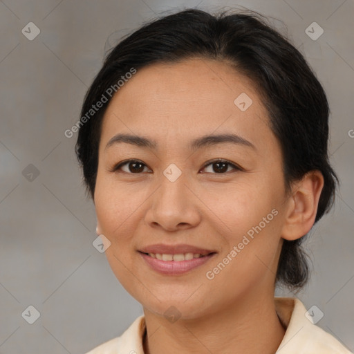 Joyful asian young-adult female with medium  brown hair and brown eyes