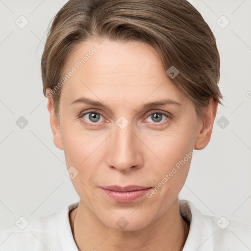 Joyful white young-adult female with short  brown hair and grey eyes