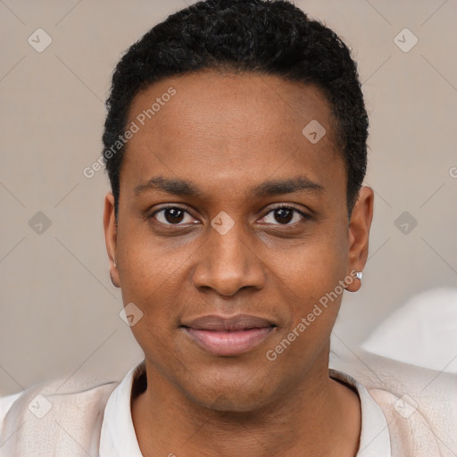 Joyful black young-adult male with short  black hair and brown eyes