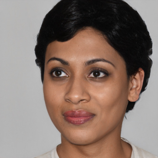 Joyful asian young-adult female with medium  black hair and brown eyes