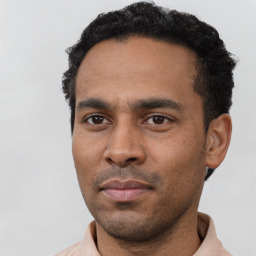 Neutral latino young-adult male with short  black hair and brown eyes