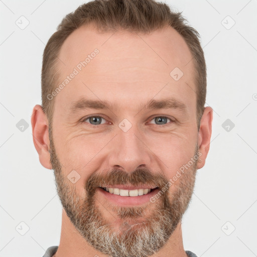 Joyful white adult male with short  brown hair and grey eyes