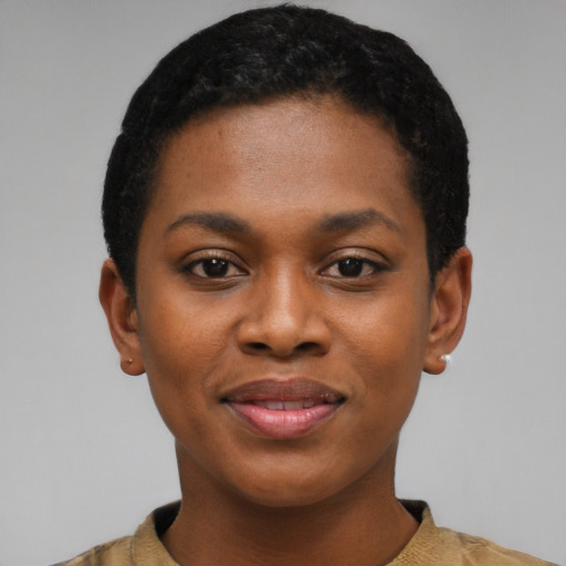 Joyful black young-adult female with short  black hair and brown eyes