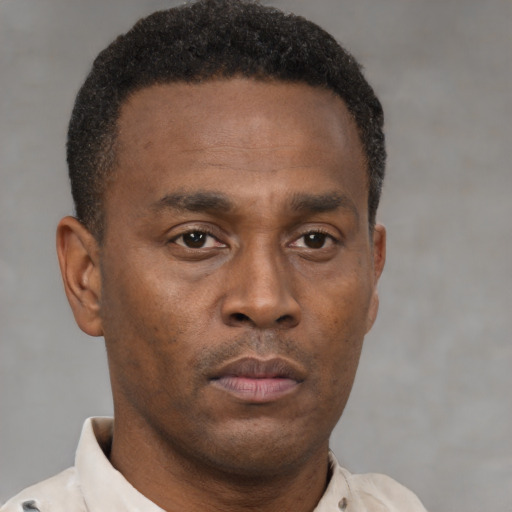 Neutral black young-adult male with short  brown hair and brown eyes