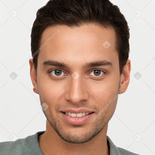 Joyful white young-adult male with short  brown hair and brown eyes