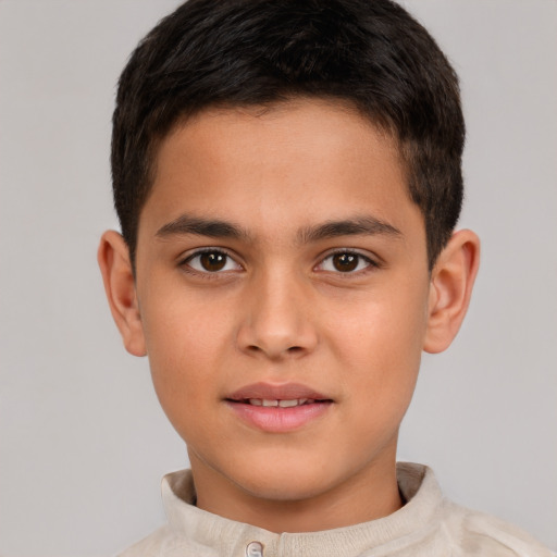 Joyful white child male with short  brown hair and brown eyes