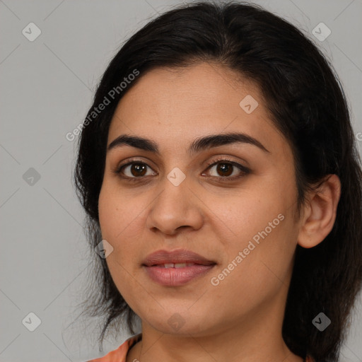 Joyful latino young-adult female with medium  brown hair and brown eyes