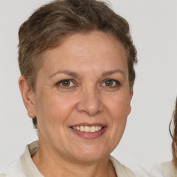 Joyful white adult female with short  brown hair and brown eyes