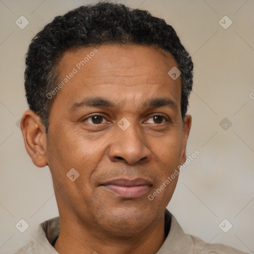 Joyful latino adult male with short  black hair and brown eyes