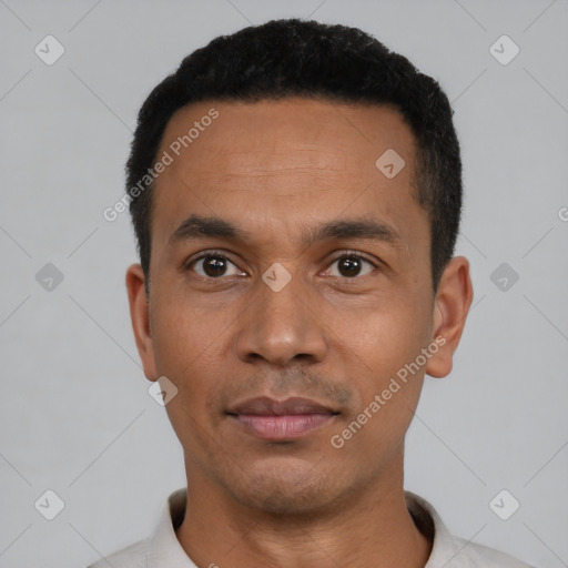Neutral latino young-adult male with short  black hair and brown eyes