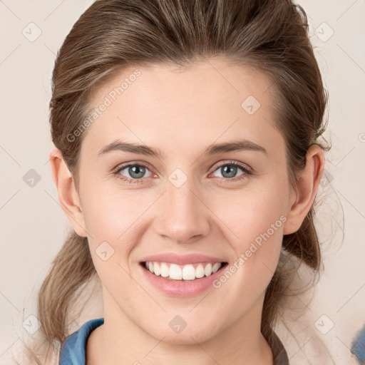 Joyful white young-adult female with medium  brown hair and blue eyes